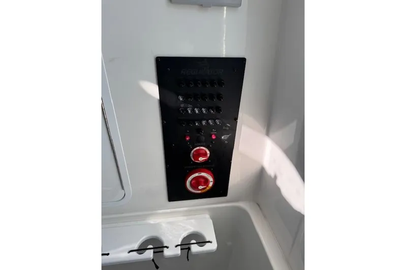  Yacht Photos Pics Control panel of 2023 Regulator 31 boat with switches and dials.