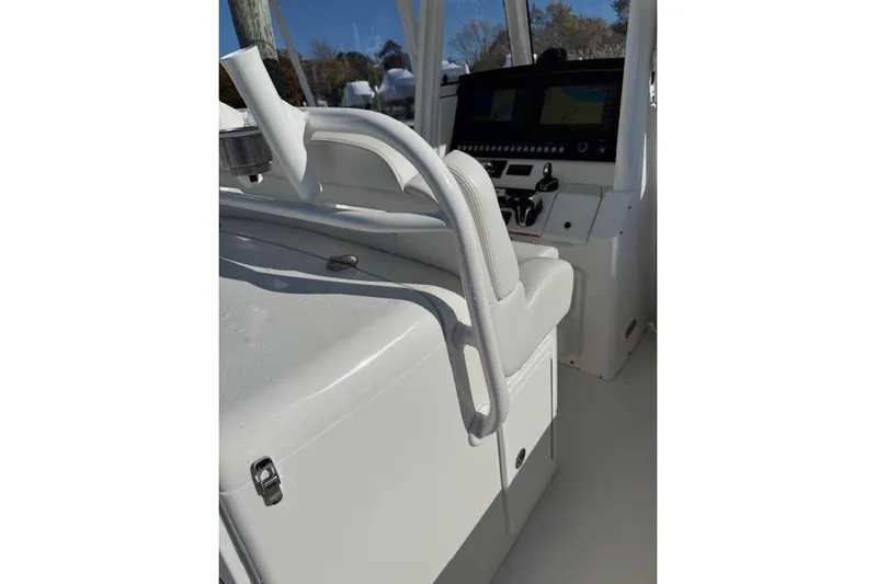  Yacht Photos Pics 2023 Regulator 31 boat interior with helm and seating area.
