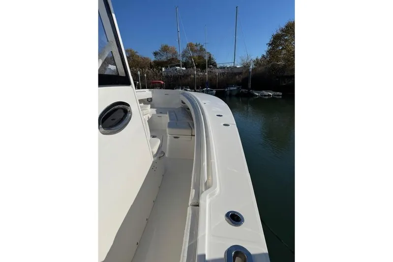  Yacht Photos Pics 2023 Regulator 31 boat deck view with seating and rod holders.