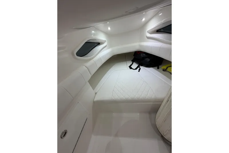  Yacht Photos Pics Interior cabin of 2025 Deep Impact 369 Sport boat, featuring white seating and modern design.