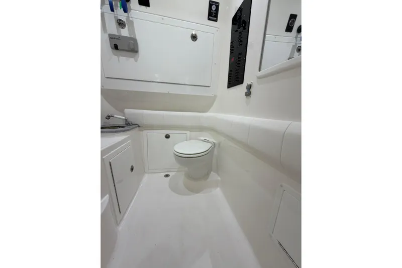  Yacht Photos Pics 2025 Deep Impact 369 Sport boat bathroom with modern fixtures and white interior design.