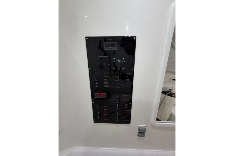  Yacht Photos Pics Control panel of 2025 Deep Impact 369 Sport boat, featuring various switches and indicators.
