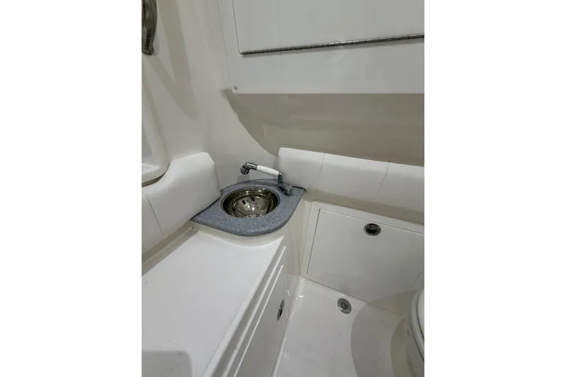  Yacht Photos Pics Compact bathroom sink area in 2025 Deep Impact 369 Sport boat.