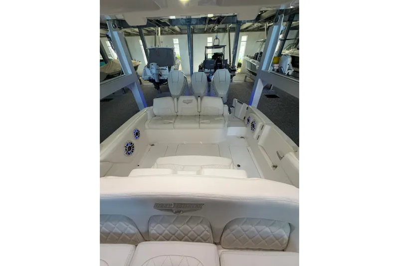  Yacht Photos Pics 2025 Deep Impact 369 Sport boat interior with luxurious white seating and modern design.