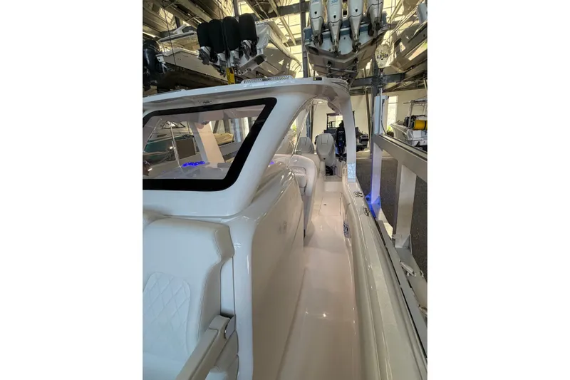  Yacht Photos Pics 2025 Deep Impact 369 Sport boat interior with sleek white seating and modern design.