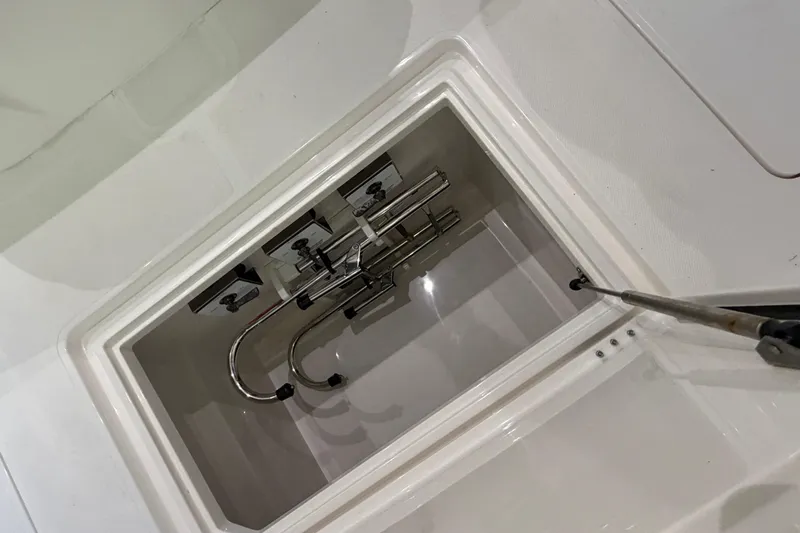  Yacht Photos Pics Open compartment on 2025 Deep Impact 369 Sport boat, showing interior fittings.