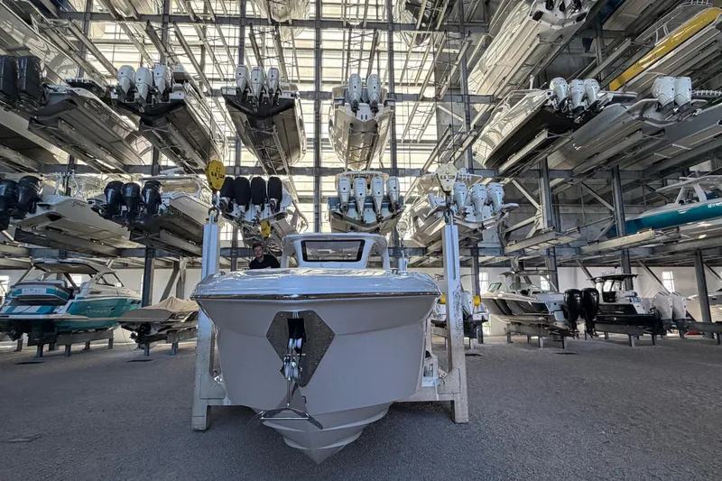  Yacht Photos Pics 2025 Deep Impact 369 Sport boat in a large indoor storage facility.