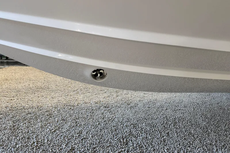  Yacht Photos Pics 2025 Deep Impact 369 Sport boat hull detail on gravel surface.