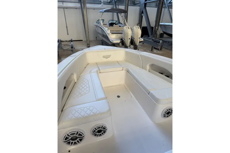  Yacht Photos Pics 2025 Deep Impact 369 Sport boat interior with white seating and speakers.