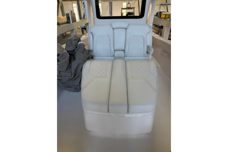  Yacht Photos Pics 2025 Deep Impact 369 Sport boat interior with white cushioned seating.