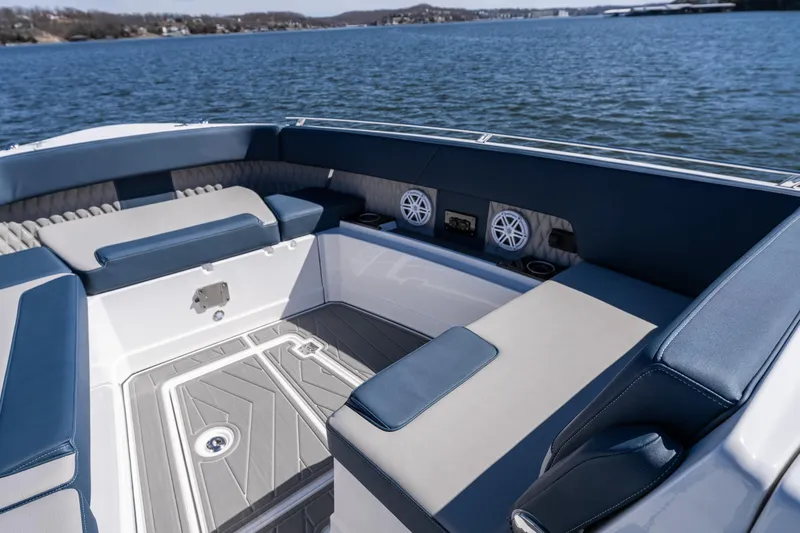  Yacht Photos Pics Luxurious seating area on 2026 Monterey 378SS Super Sport boat, overlooking serene water.