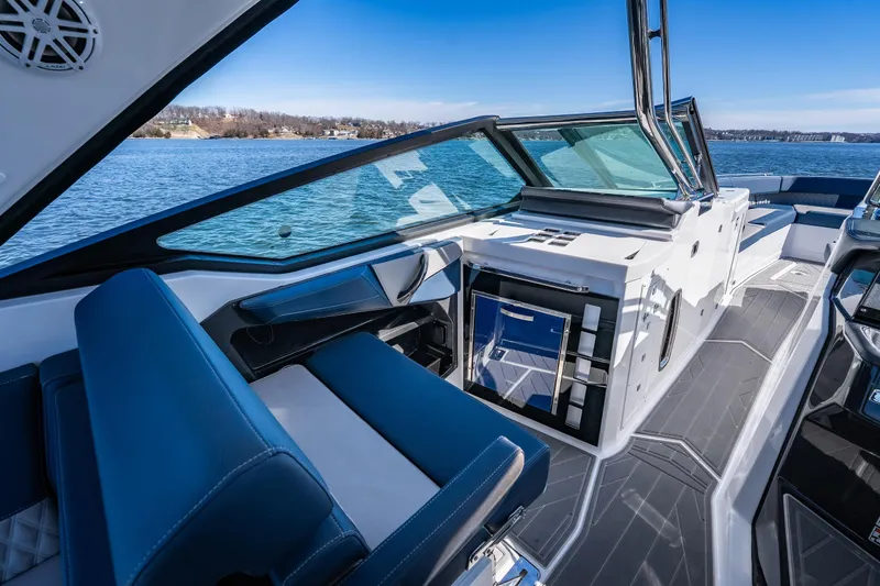  Yacht Photos Pics Luxurious interior of 2026 Monterey 378SS Super Sport boat on a serene lake.