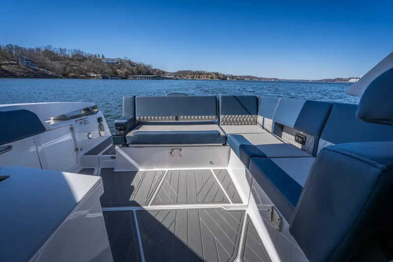  Yacht Photos Pics Luxurious seating on 2026 Monterey 378SS Super Sport boat, overlooking serene lake view.