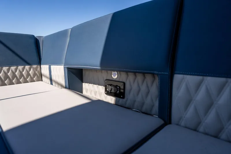  Yacht Photos Pics Luxurious seating on 2026 Monterey 378SS Super Sport boat, featuring blue and gray upholstery.