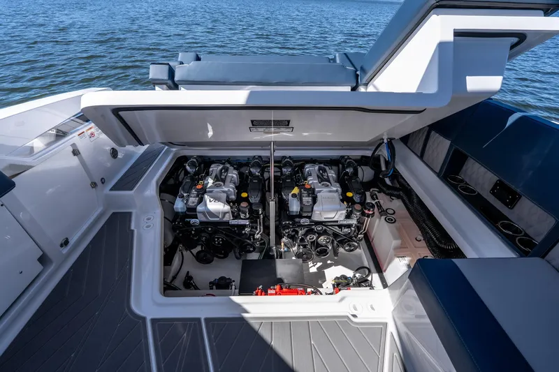  Yacht Photos Pics Engine compartment of 2026 Monterey 378SS Super Sport boat, open hatch, on water.
