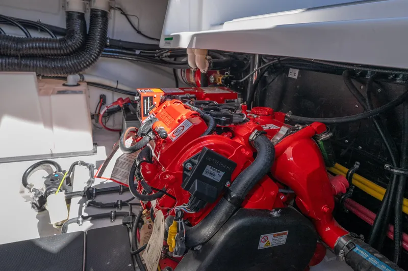  Yacht Photos Pics Engine compartment of 2026 Monterey 378SS Super Sport boat, featuring vibrant red components.