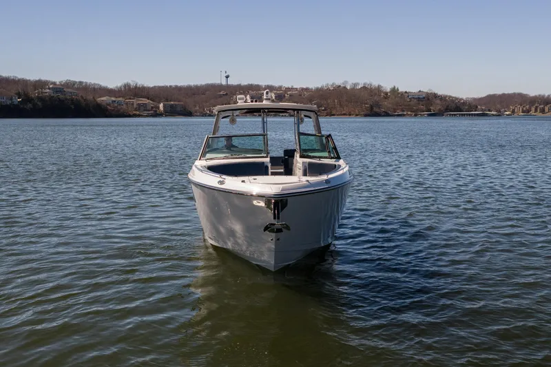  Yacht Photos Pics 2026 Monterey 378SS Super Sport boat on a calm lake under clear skies.
