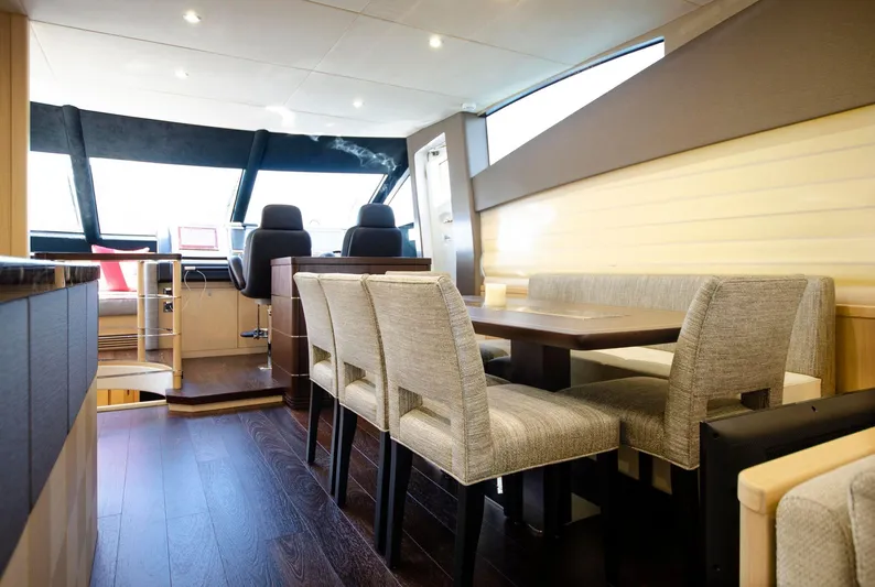  Yacht Photos Pics Interior of 2018 Sunseeker 75 Yacht with dining area and helm station.