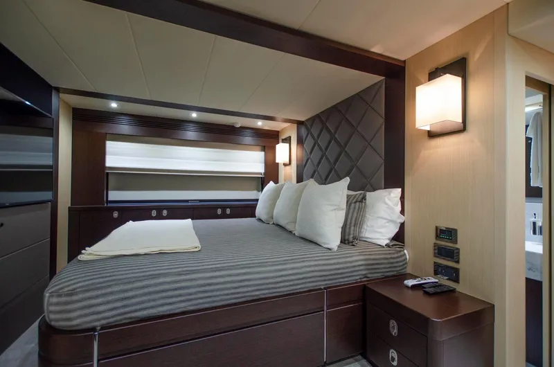  Yacht Photos Pics Luxurious bedroom interior of 2018 Sunseeker 75 Yacht with modern lighting and elegant decor.