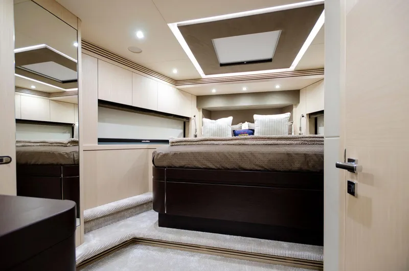  Yacht Photos Pics Luxurious bedroom interior of 2018 Sunseeker 75 Yacht with modern design and ambient lighting.