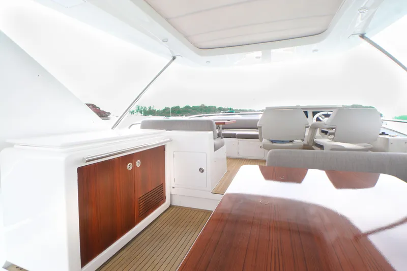  Yacht Photos Pics Interior of a 2019 Azimut 66 yacht with elegant wood finishes.