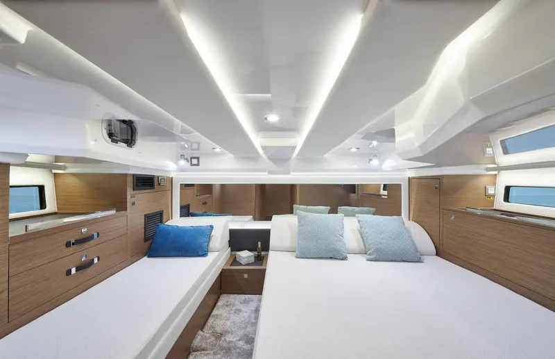  Yacht Photos Pics Luxurious cabin interior of 2021 Jeanneau Leader 12.5 with modern design and comfortable bedding.