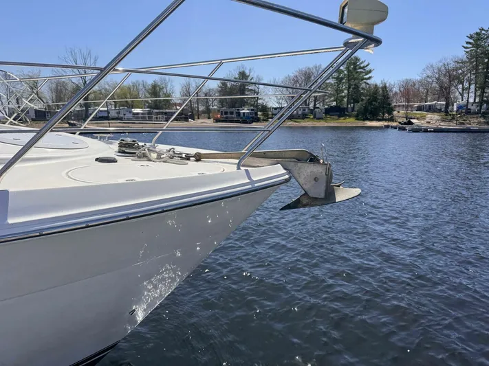  Yacht Photos Pics 2004 Carver 460 Voyager yacht on calm water, showcasing sleek bow design.
