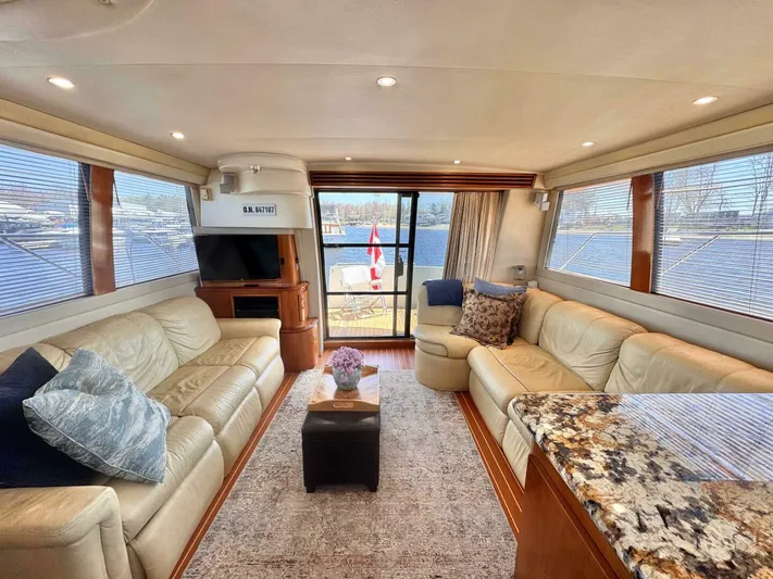  Yacht Photos Pics Luxurious interior of 2004 Carver 460 Voyager yacht with plush seating and elegant decor.