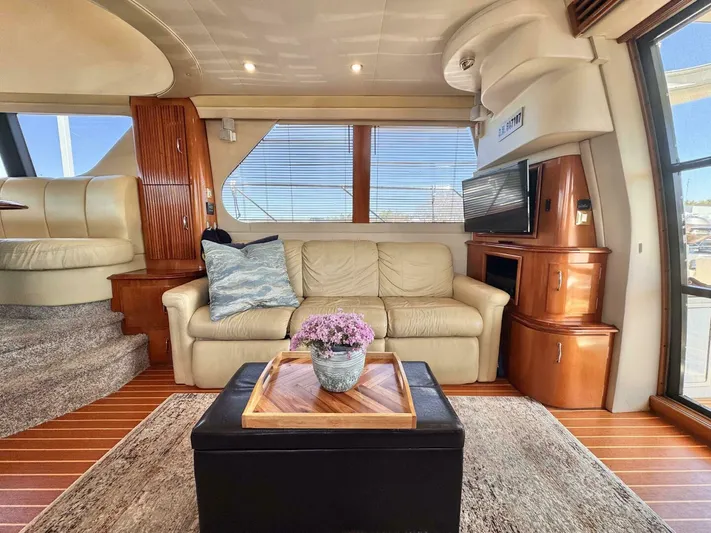  Yacht Photos Pics Luxurious interior of 2004 Carver 460 Voyager yacht with leather sofa and elegant decor.