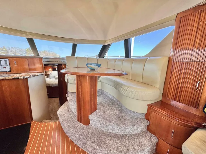  Yacht Photos Pics Luxurious interior of a 2004 Carver 460 Voyager yacht with plush seating and wooden accents.