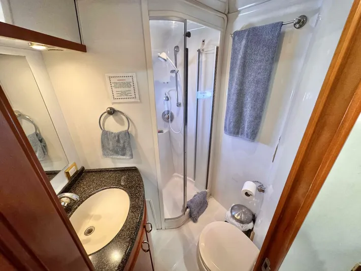  Yacht Photos Pics Bathroom interior of 2004 Carver 460 Voyager yacht with shower and sink.