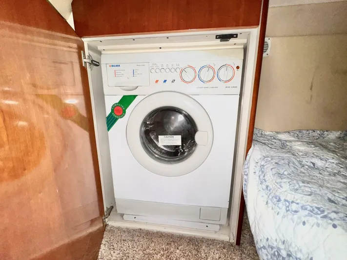  Yacht Photos Pics Washing machine inside 2004 Carver 460 Voyager yacht cabin.