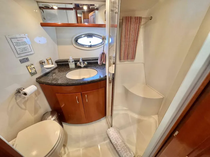  Yacht Photos Pics Luxurious bathroom in 2004 Carver 460 Voyager yacht with modern amenities and elegant design.