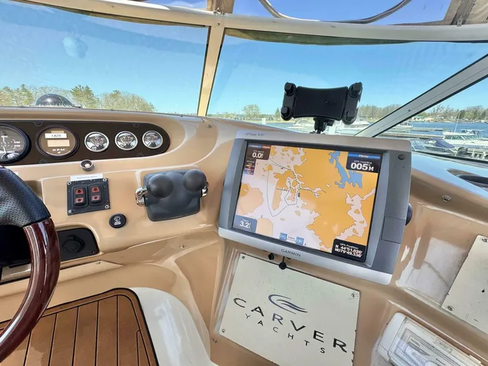  Yacht Photos Pics Carver 460 Voyager 2004 yacht dashboard with navigation system and gauges.