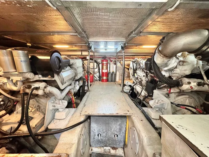  Yacht Photos Pics Engine room of a 2004 Carver 460 Voyager yacht, showcasing dual engines and equipment.