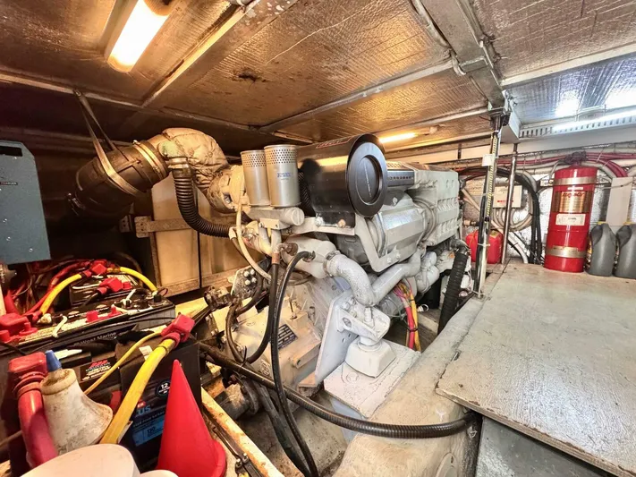  Yacht Photos Pics Engine room of a 2004 Carver 460 Voyager yacht, showcasing mechanical components and wiring.