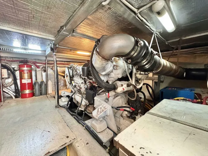 Yacht Photos Pics Engine room of a 2004 Carver 460 Voyager yacht, featuring mechanical components and fire safety equipment.