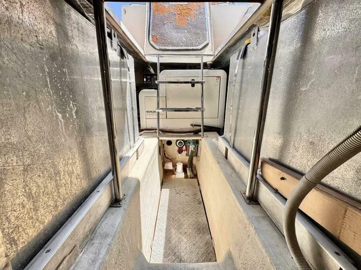  Yacht Photos Pics 2004 Carver 460 Voyager engine room with visible equipment and metallic surfaces.