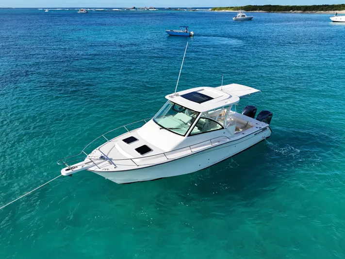  Yacht Photos Pics 2021 Grady-White Express 330 boat on clear turquoise water.