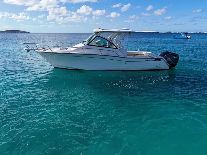  Yacht Photos Pics 2021 Grady-White Express 330 boat on clear blue ocean water.