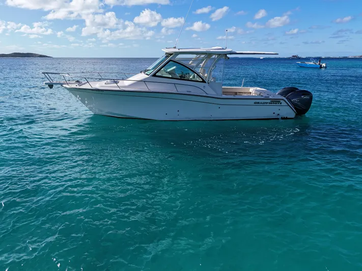  Yacht Photos Pics 2021 Grady-White Express 330 boat on clear blue water.