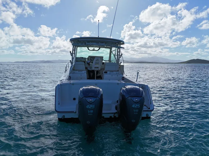  Yacht Photos Pics Grady-White Express 330 boat, 2021 model, on open water with twin 425 engines.