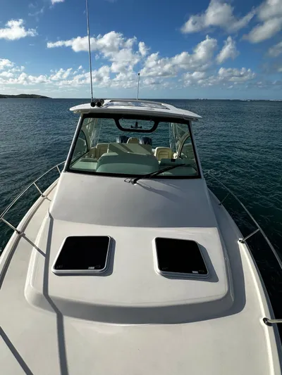  Yacht Photos Pics 2021 Grady-White Express 330 boat on open water under blue sky.