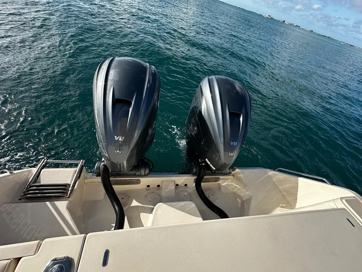  Yacht Photos Pics 2021 Grady-White Express 330 with twin outboard engines on open water.