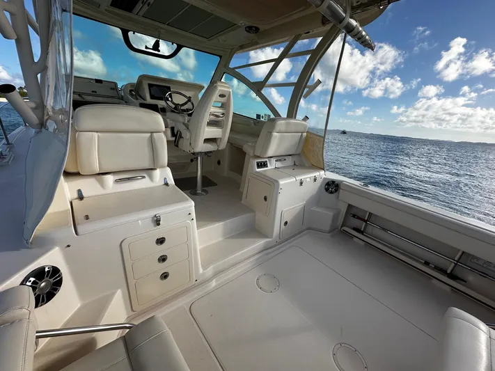  Yacht Photos Pics 2021 Grady-White Express 330 boat interior with ocean view and clear sky.