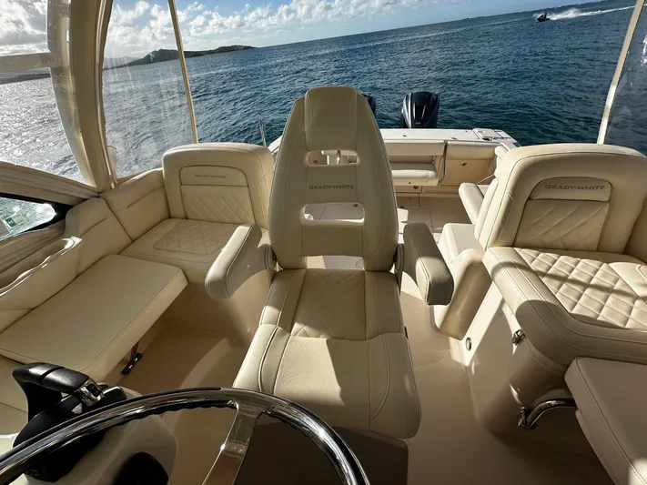  Yacht Photos Pics Luxurious 2021 Grady-White Express 330 boat interior with plush seating and ocean view.