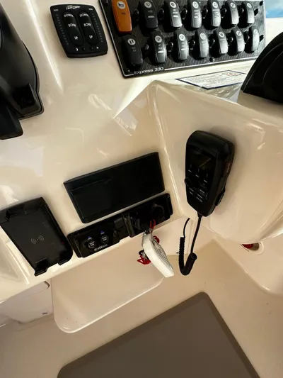  Yacht Photos Pics Control panel of 2021 Grady-White Express 330 boat with various switches and devices.