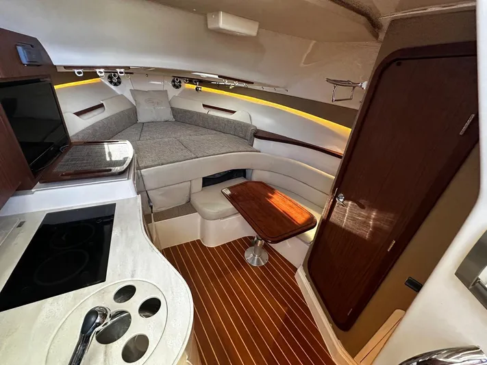  Yacht Photos Pics Luxurious 2021 Grady-White Express 330 cabin interior with modern amenities and elegant wood finishes.
