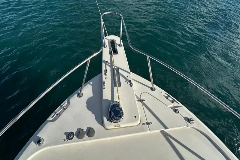  Yacht Photos Pics Grady-White Express 330 boat bow on water, 2021 model.