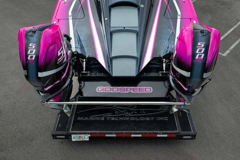  Yacht Photos Pics 2023 MTI 390XR boat with dual 500R engines, vibrant pink and black design.